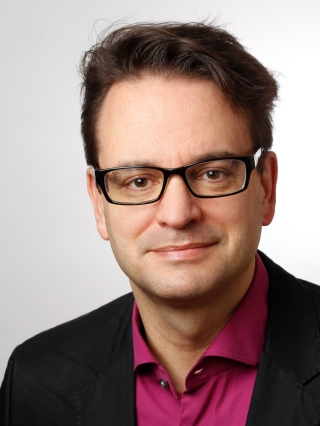 Dr. Peter Tass